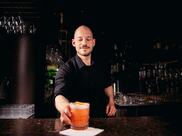 A man serves a cocktail